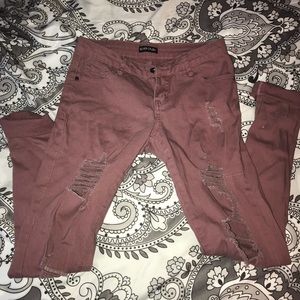 Pink distressed jeans